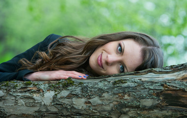 Beautiful young girl walking in spring Park