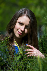 Beautiful young girl walking in spring Park