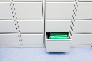 office document storage furniture grey closed all except one in the middle right