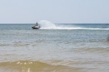 a man on a water motorcycle