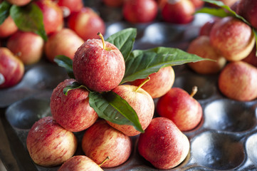 Fresh red apples on street market stall in Thailand
