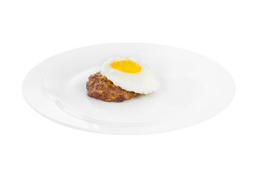 Cutlet, beef steak, lamb with scrambled eggs, on a plate, isolated white background. Side view. Serving for a cafe, a restaurant in the menu