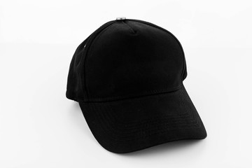 A black baseball cap on a white background