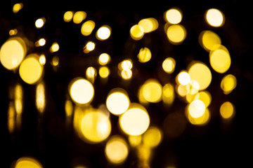 Beautiful bokeh blured light from Christmas light bulbs background.