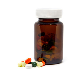 Group of pills and capsules close up on white background, concept of medical and health care.