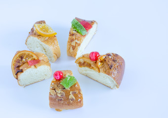 Kings cake in portions on white background.