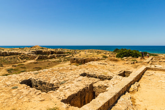 Ruins and columns of the ancient city of Paphos, Cyprus. Mediterranean Sea in the background. 