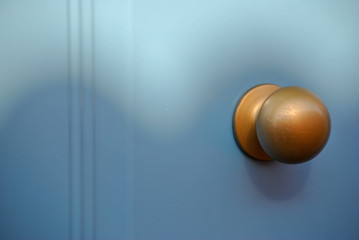 blue door and golden knob