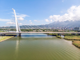 Shezi Bridge - landmark of Taipei, Taiwan with beautiful illumination at day, aerial photography in Taipei, Taiwan.