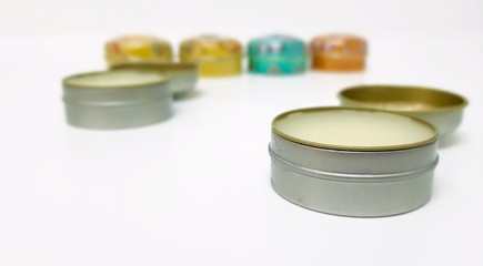 Lip balms on white background