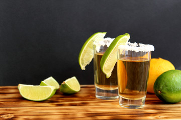 two glasses of tequila with lime and salt