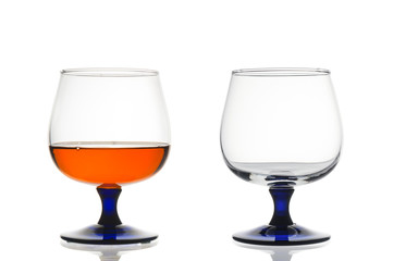 Two brandy glasses close up isolated on white background