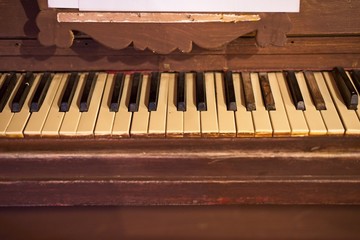 Fototapeta na wymiar Vintage old piano. Close-up of keyboard keys