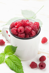 Cup of ripe raspberries