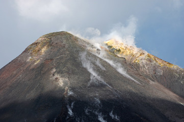 Volcano Etna Sicily Italy peak with steam and sulfur