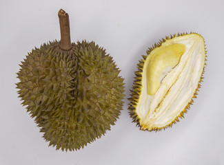 Fototapeta premium Whole and cut durian on white background. Cut durian flat lay banner template with text place. Exotic fruit durian
