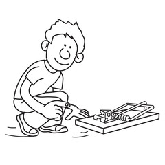 Young boy setting up a mouse trap with a piece of cheese inside watching looking carefully