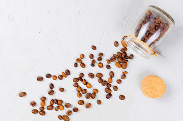 scattered coffee beans from a jar