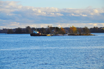 cargo ship in the sea at sunset