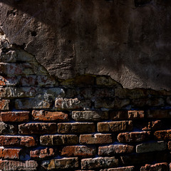 old brick wall and plaster. Element of design.