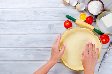 raw base of pastry for baking in a baking dish