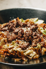 Delicious spicy noodles with meat in pot, traditional Aisan foo