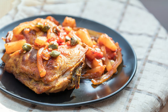Delicious baked chicken with vegetables and capers