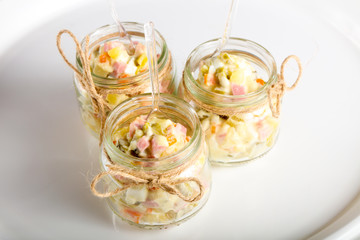 Russian salad in the glass can