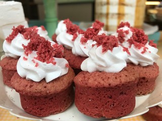 Homemade red velvet cupcakes with whipped cream