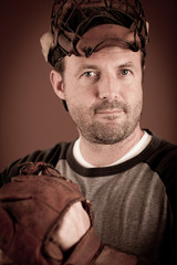 Portrait of a Baseball Athlete with Glove and Mask