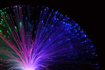 Abstract background a Optical fiber lamp. Closeup of colorful optical fibers