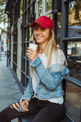 a sport girl  with coffee  in the morning on the street