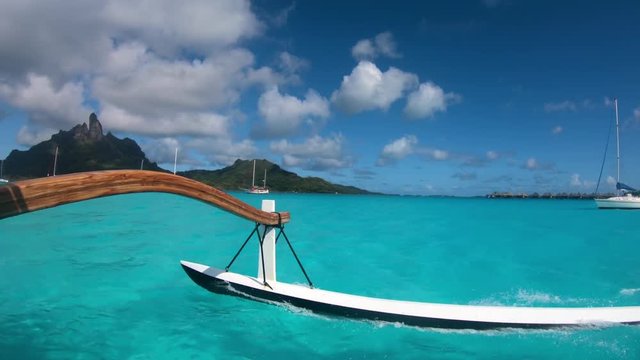 Sailing around blue lagoon and Otemanu mountain at Bora Bora island, Tahiti, French Polynesia (view from action camera)
