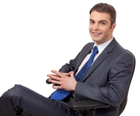 Businessman Sitting on Office Chair with Crossed Legs