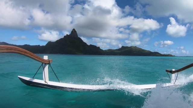 Sailing around blue lagoon and Otemanu mountain at Bora Bora island, Tahiti, French Polynesia (view from action camera)
