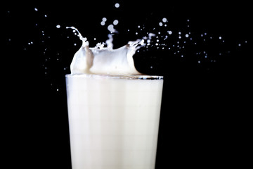 Glass with splashing milk