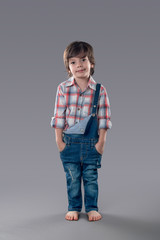 the boy in overalls