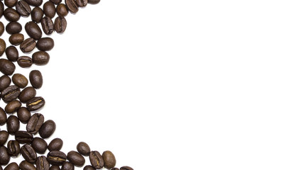Coffee beans carefully spread around white background, with copy space in the middle and right side.