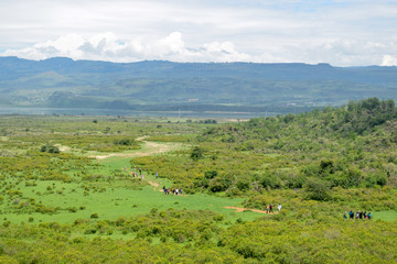 Hikers against the mountain background at Lake Elementaita, Naivasha, Kenya