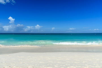 Fototapeta na wymiar White sand and turquoise water. Dreamy background.