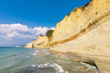 Fototapeta na wymiar Logas Beach and amazing rocky cliff in Peroulades. Corfu Island. Greece