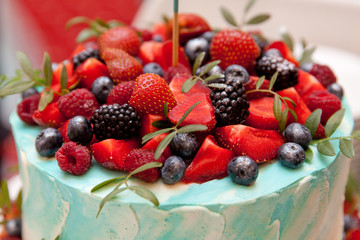 cake decorated with fresh berries