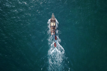 beautiful turquoise ocean water with boat on it top view aerial photo