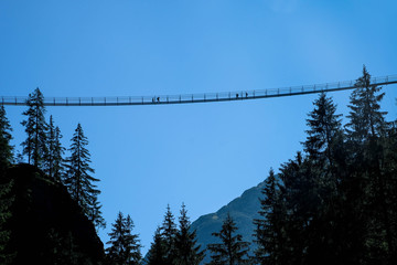 rope bridge over a deep canyon, tirol, austria
