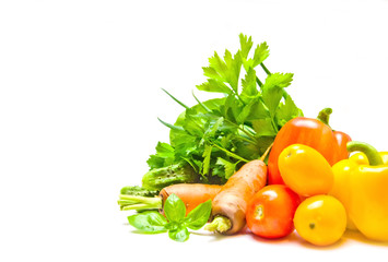 vegetables greens peppers carrots and tomatoes white background selective focus 