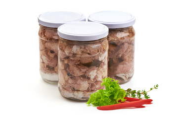 Canned meat in a glass jar, isolated on white background.