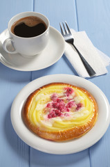 Bun with custard and coffee