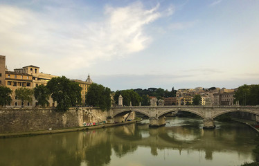 Fototapeta na wymiar Rome/ Italy - Panoramic view of Vittorio Emanuele II bridge and the Tiber river and its banks.