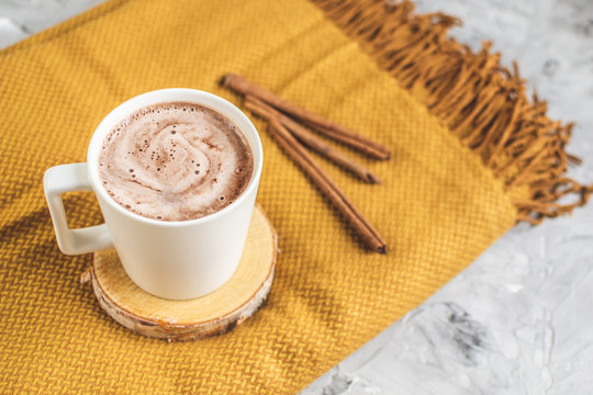 White Cup of Hot Chocolate, Yellow Plaid, Leaves, Gray Background, Autumn Concept, Cosiness, Instagram Style