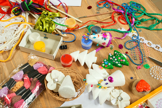 Handmade decorations for new year and other holidays. Artwork workplace with creative accessories.